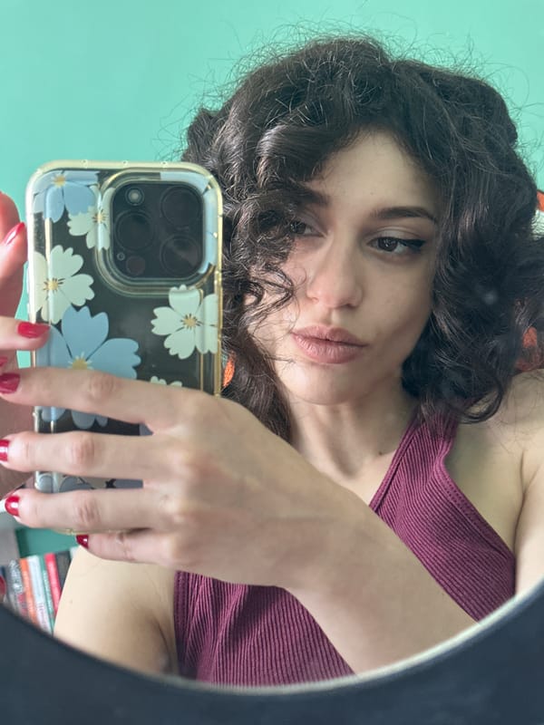Selfie session in a Sofia room with a mint green wall.