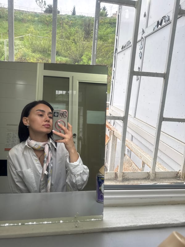 Woman documents morning routine in Tbilisi office setting