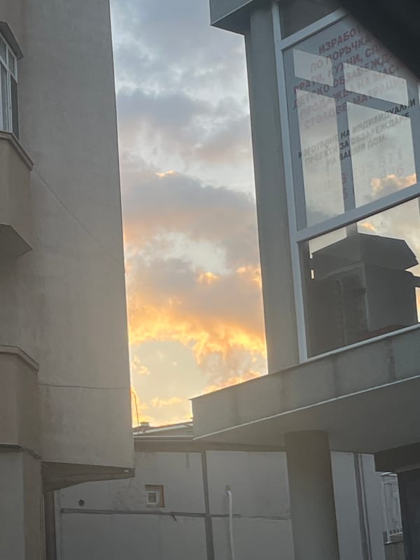 Golden sky viewed through building architecture in Blagoevgrad