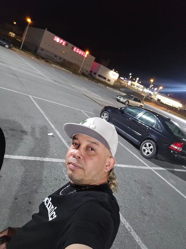 Nighttime selfies taken outside Super Segovia building parking lot
