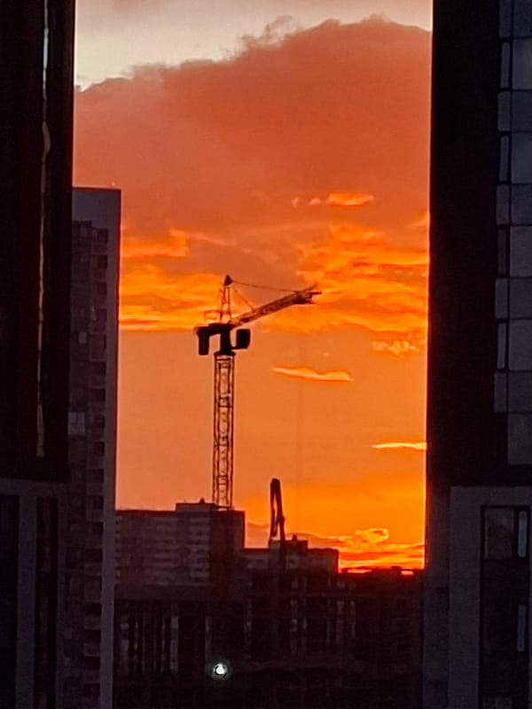 Moscow apartment evening: vivid sunset, everyday interior details