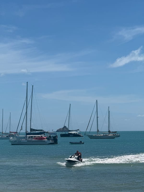 Jet skis and beach gear on a calm Choeng Mon morning