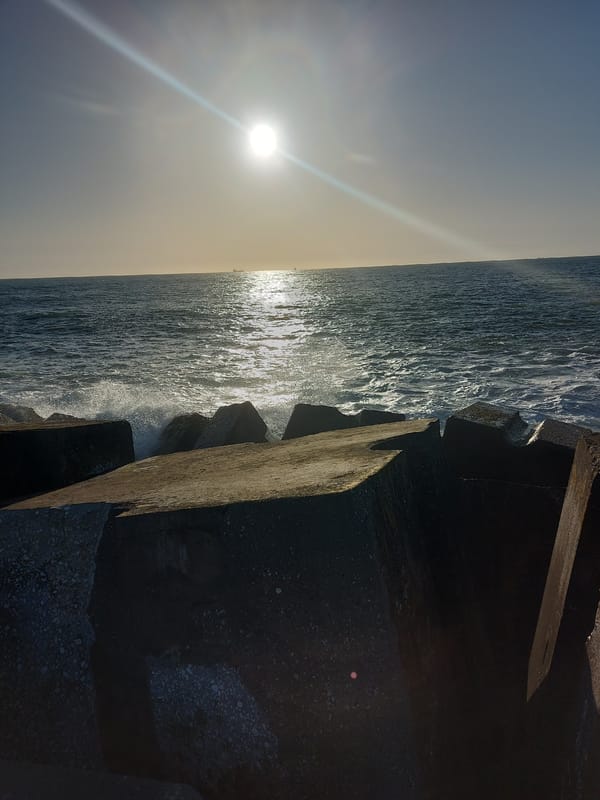 Evening coastal activity documented at Figueira da Foz breakwater