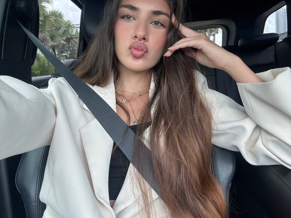 Woman in white blazer observed in car in Miami