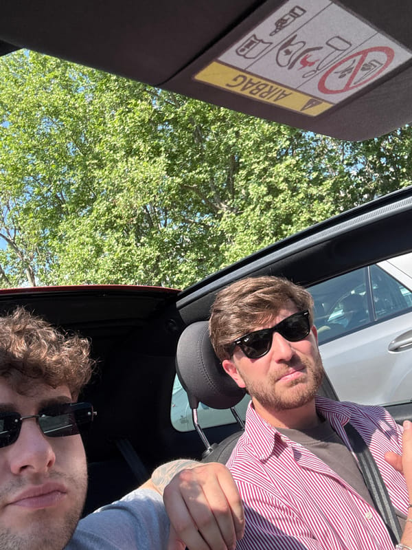 Two men spotted in sunlit car in Milan