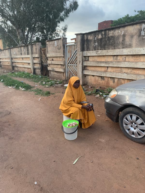 Street life and commerce moving through Jos, Nigeria