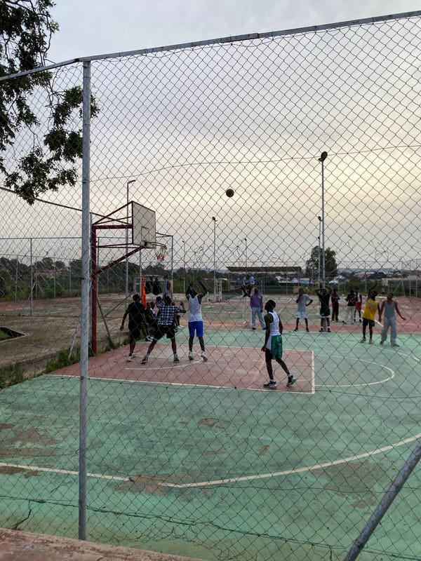Basketball pickup game at an outdoor court in Jos, Nigeria