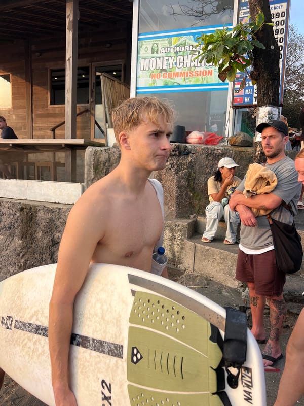 Golden hour crowd gathers at Kuta Beach for sunset and street food