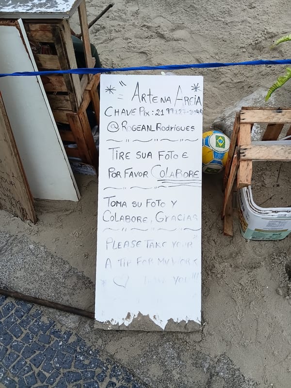 Beach artist creates sand sculptures in Rio, seeks donations