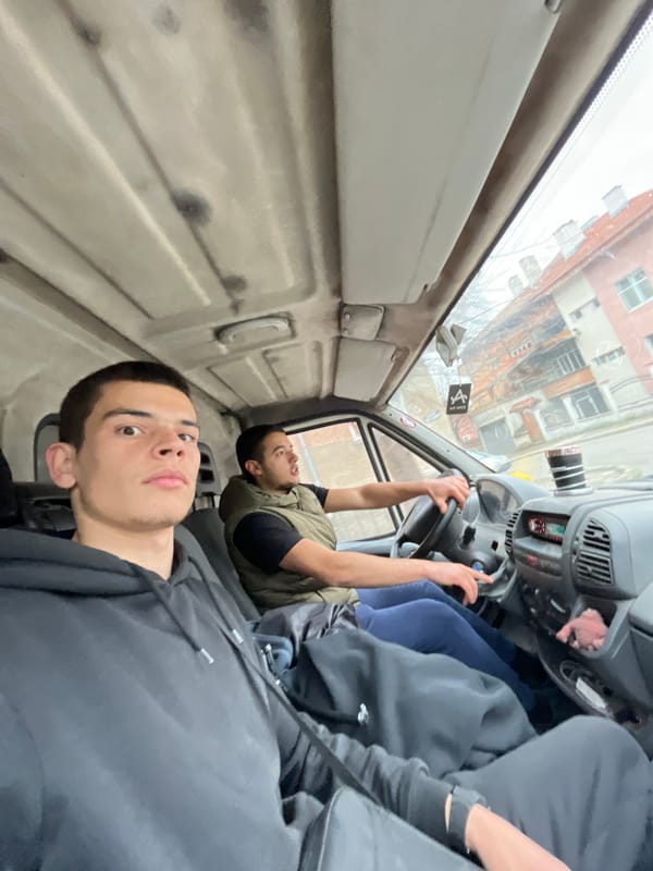 Two men travel by van in Sopot, Bulgaria