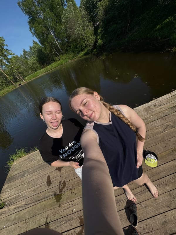 Friends enjoy swimming and selfies at Russian waterfront dock