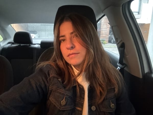 Woman photographed in car backseat during late night Puebla journey