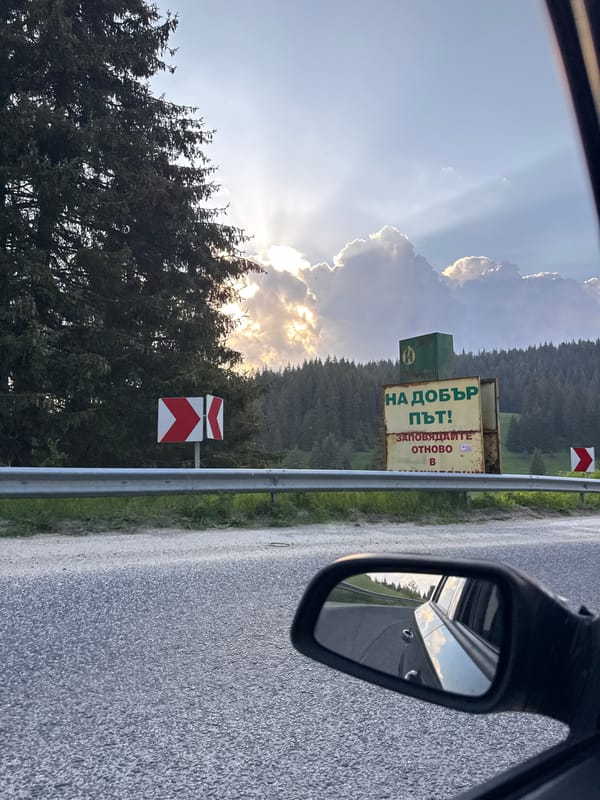 Bulgarian flag observed from moving vehicle in Smolyan mountains