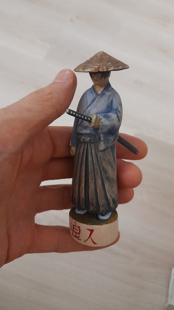 Quiet evening moments: samurai figurine and resting dog in Petersburg