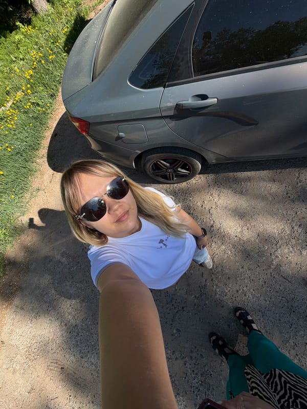 Two women take selfies outdoors in Chaikovsky, Russia