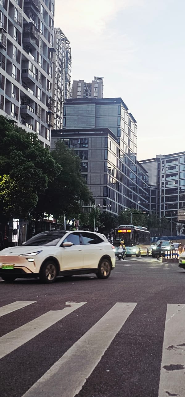Regular traffic flows through downtown Yuzhong District streets