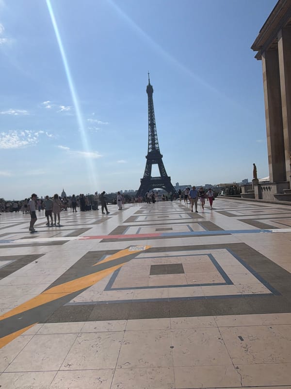 Sunny morning at the Eiffel Tower and surrounding streets