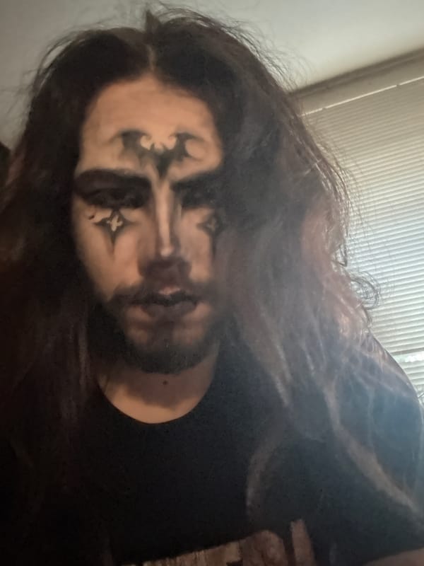 Gothic bat face paint look, captured across multiple selfies