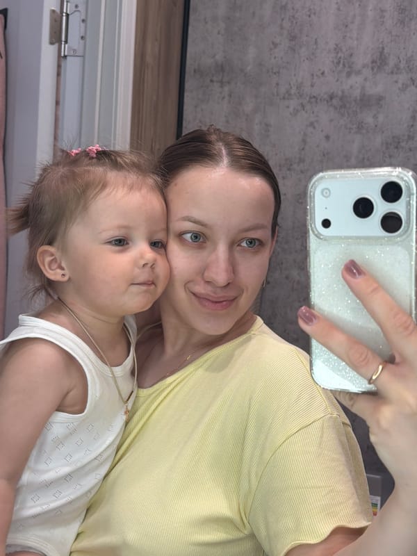Mother and toddler take morning selfies in Reshetnikovo home