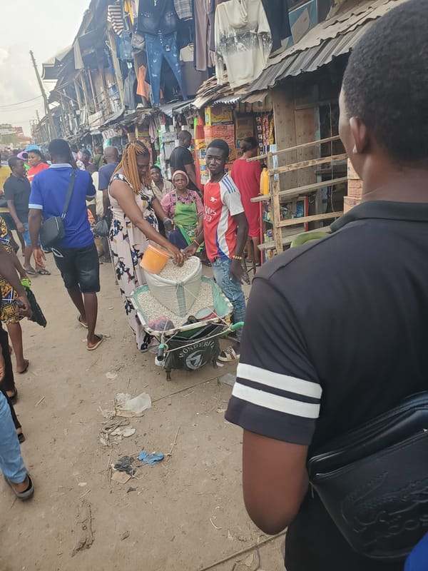 Street vendor sells grains from cart in Fegge, Nigeria