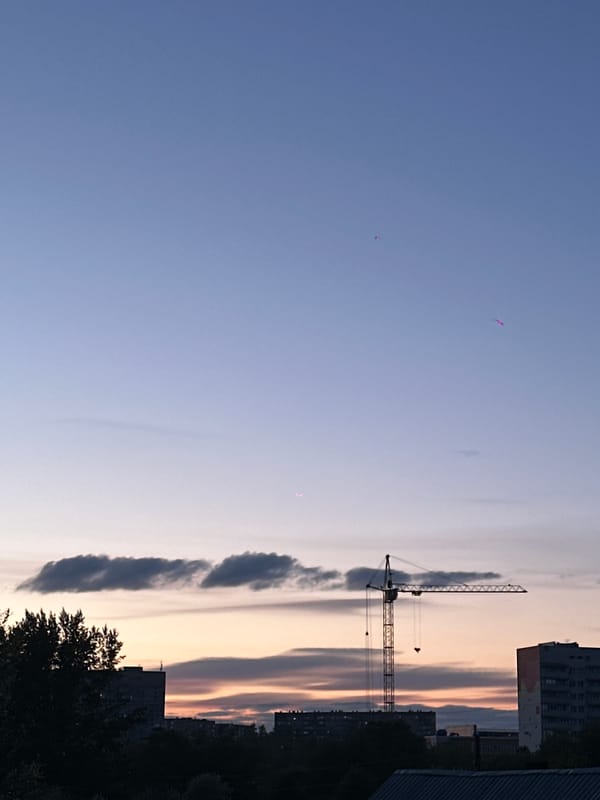 Construction cranes documented at dusk in Biysk, Russia