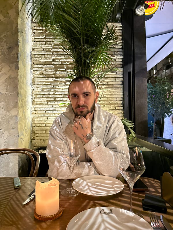 Woman performs acoustic guitar in dimly lit Yerevan venue