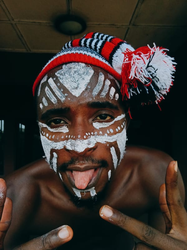 Man in tribal face paint photographed in Nkpor, Nigeria
