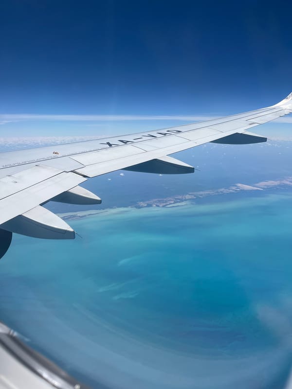 Aircraft XA-VAO flies over tropical waters near Ukum, Mexico