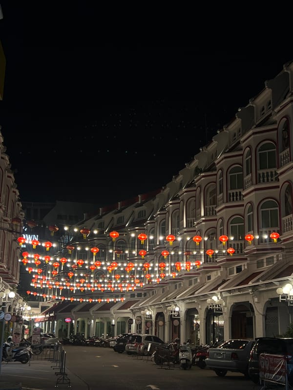 Nighttime street photography captures Phuket architecture with festive lighting