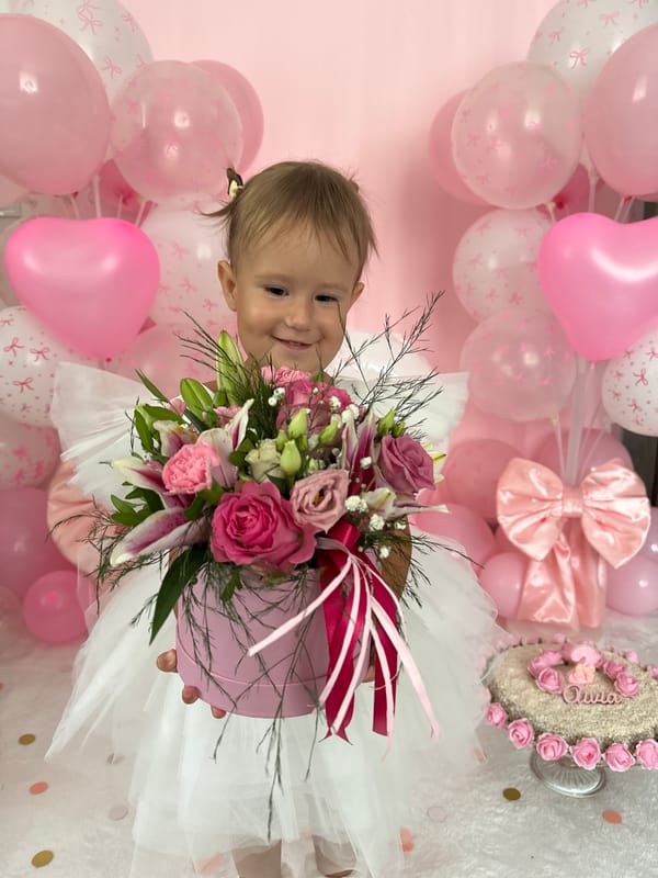 Pink flower box presented in a heartfelt indoor moment, Wisła