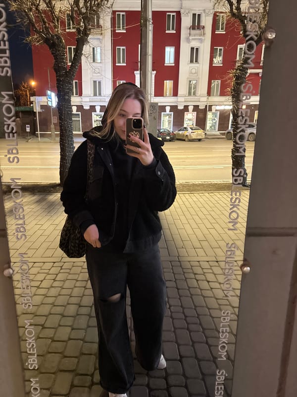 Woman takes mirror selfie on Krasnoyarsk street