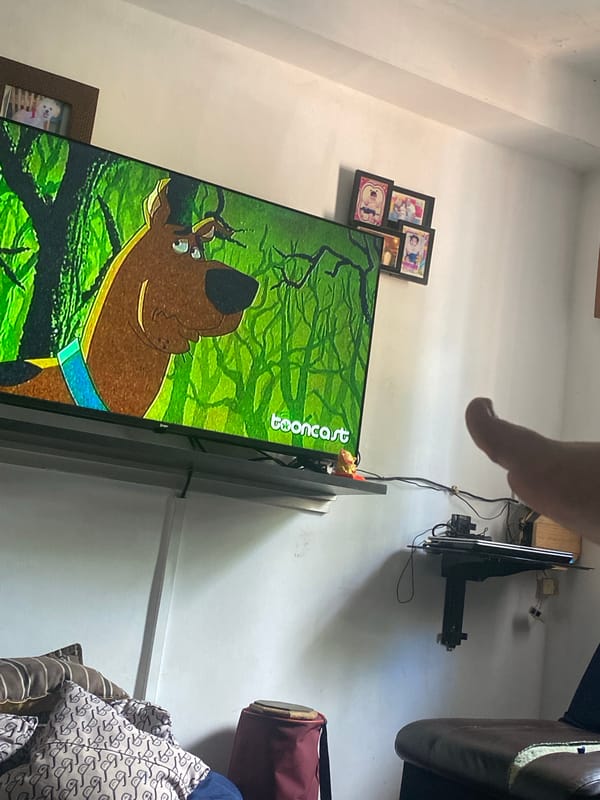 Resident watches Scooby-Doo in pajamas at home