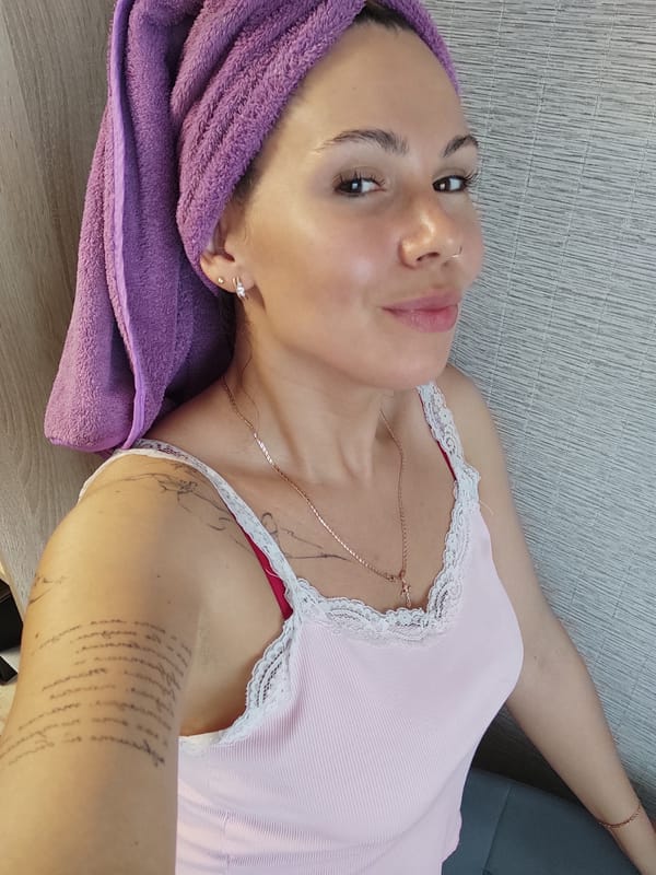 Woman with purple towel observed resting in Chaikovsky, Russia
