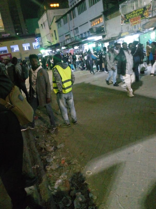 Long queue forms outside Nairobi building at night