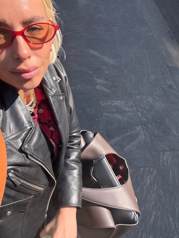 Woman in red sunglasses spotted with matcha drink in Milan