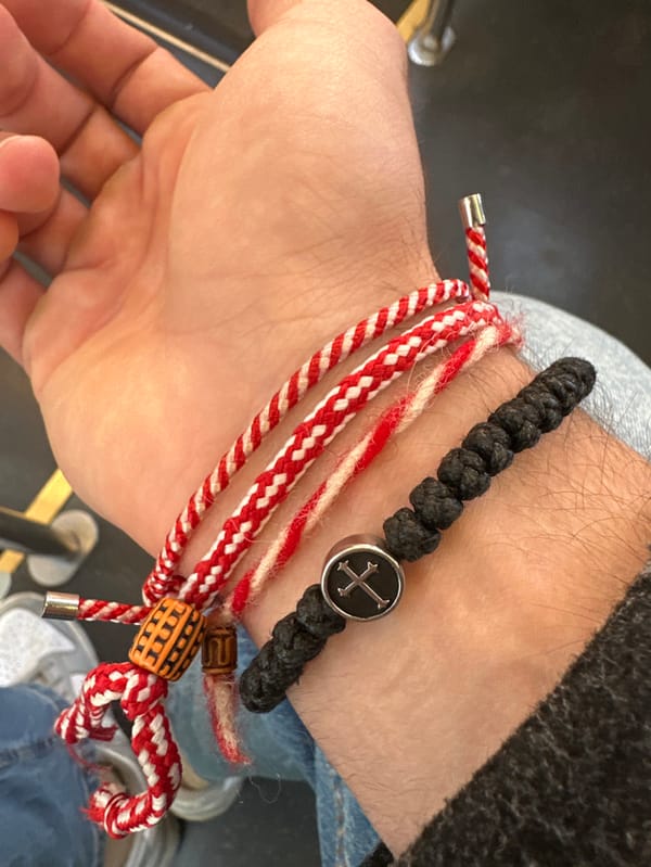 Person wears braided bracelets amid superstition-themed social media content