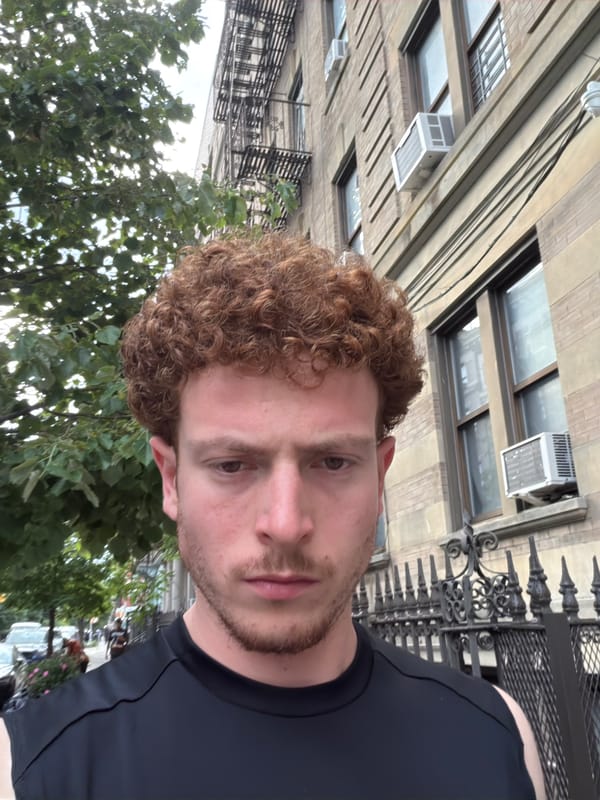 Man spotted near NYC university buildings under overcast evening sky