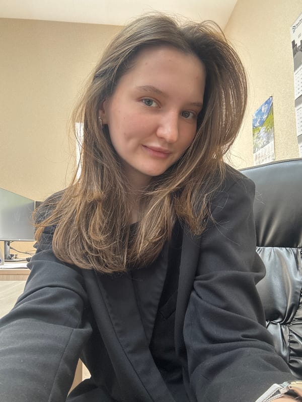 Woman takes casual selfies indoors in Perm, Russia
