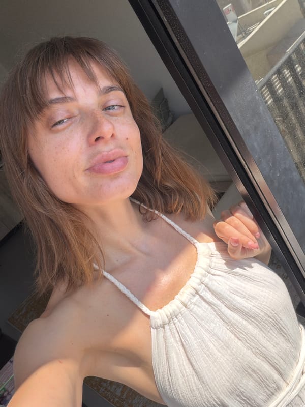 Outdoor selfie in Tel Aviv, white halter dress