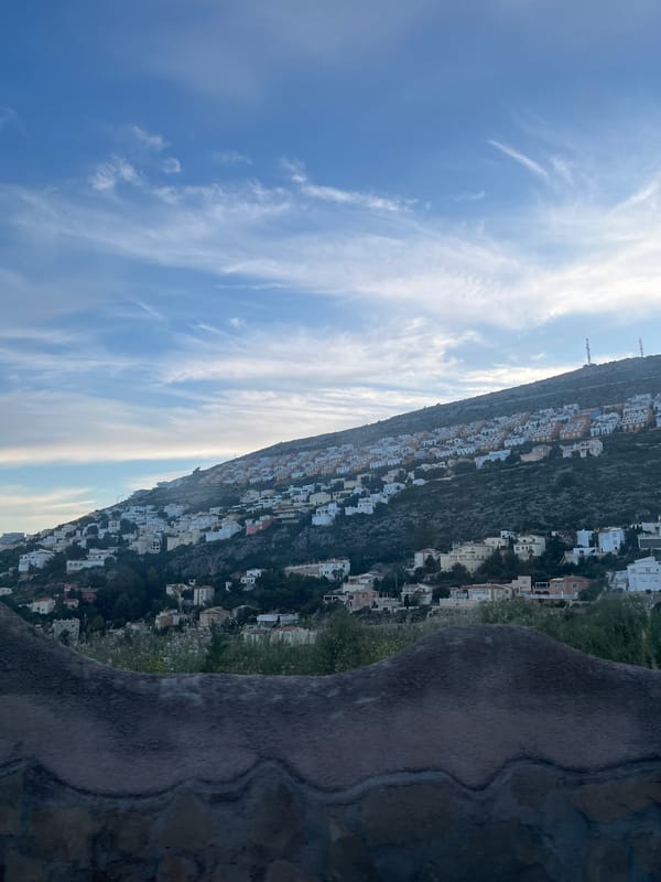 White villas on Spanish hillside captured in evening photograph
