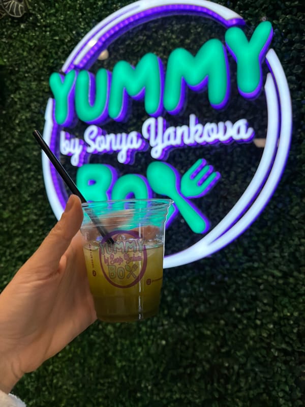 Person enjoys drink at Yummy restaurant in Sofia