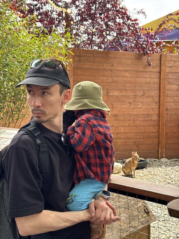 Father and child visit petting zoo in Sochi