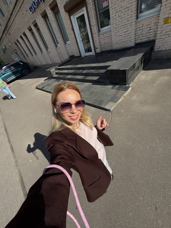 Selfie session outside a brick building in Sinyavino