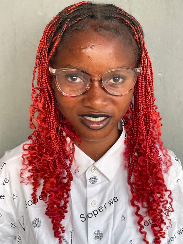 Portrait session captured in Badagry featuring woman with red braids