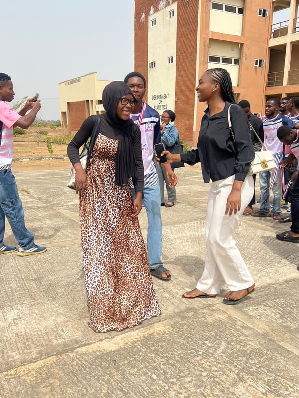 Groups gather, take photos outside Statistics Department in Minna