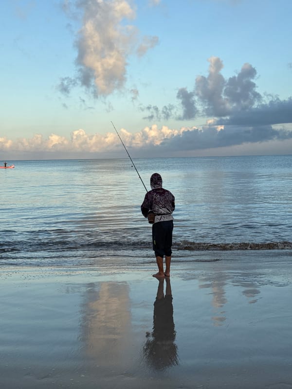 Evening fishing activities documented along Kuta beach, Indonesia