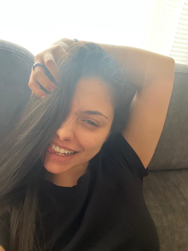 Woman relaxes on couch in Sofia apartment