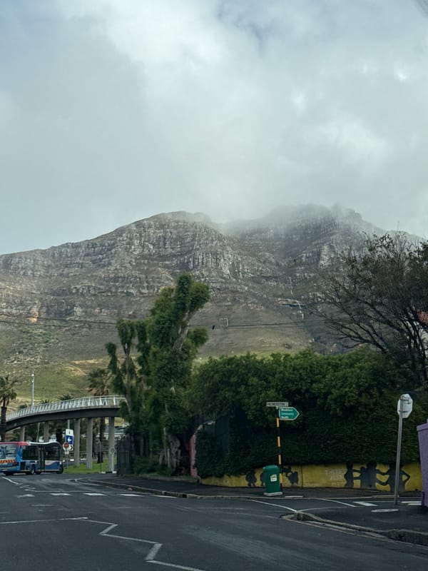 Misty Table Mountain witnessed during rainy Cape Town street journey