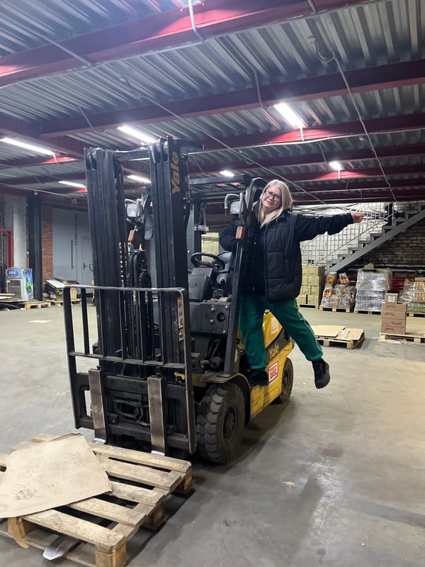 Woman poses for photos inside beverage warehouse in Izhevsk