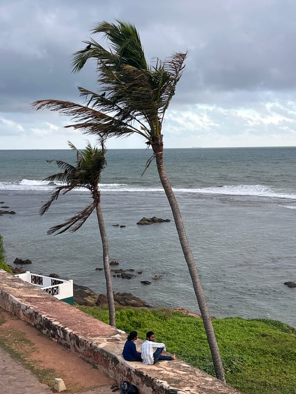 Galle Fort's ramparts and coastline on a dramatic cloudy morning